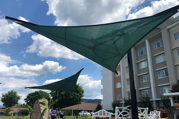 Powder-coated in-ground structure providing long-lasting outdoor shade coverage.